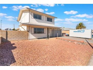 Charming two-story home with an oversized front yard and a two car garage at 212 Huntly Rd, Las Vegas, NV 89145