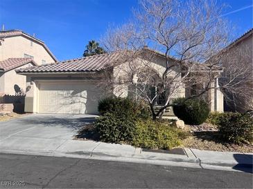 Charming single-story home with a well-manicured front yard and attached two-car garage at 2938 Sapphire Shores St, Las Vegas, NV 89117