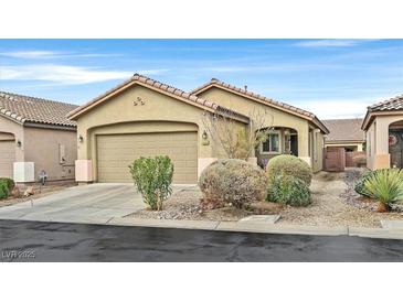 Charming single-story home with a two-car garage and low-maintenance desert landscaping at 6144 Corbin Ave, Las Vegas, NV 89122