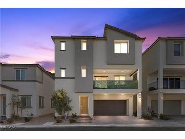 Charming two-story home featuring a modern design and a welcoming, covered balcony at 6855 Evening Orchid St, North Las Vegas, NV 89086