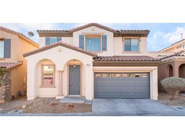 Charming two-story home with a two-car garage and desert landscaping in a residential neighborhood at 8045 Sundance Valley Dr, Las Vegas, NV 89178