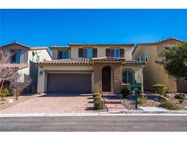 Charming two-story home with a brick driveway and two-car garage in a desirable neighborhood at 12816 Alcores St, Las Vegas, NV 89141