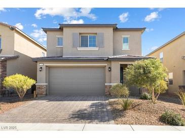 Charming two-story home with a paver driveway and a two-car garage at 2740 Aldine Ct, Las Vegas, NV 89142