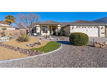 Charming single story home with well manicured xeriscape front yard and decorative rock detail at 341 Dylan Pl, Pahrump, NV 89048