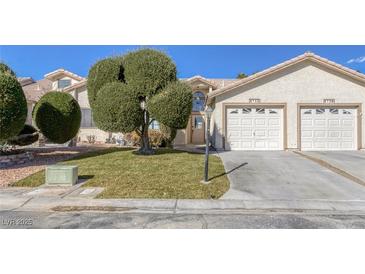 Charming home featuring a well-manicured lawn and a two-car garage, perfect for suburban living at 5732 Colwood Ln, Las Vegas, NV 89130