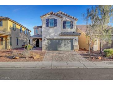 Charming two-story home with a brick driveway and a well-maintained front yard at 5736 Clear Haven Ln, North Las Vegas, NV 89081