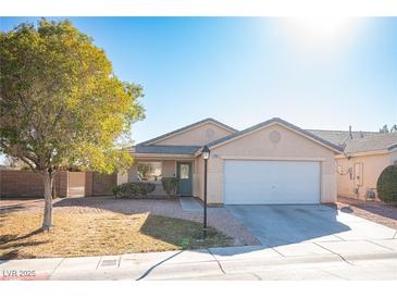 Charming single-story home featuring a well-maintained lawn and a two-car garage at 7485 Rainbow Spray Dr, Las Vegas, NV 89131