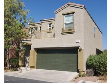 Charming two-story home featuring a balcony, a two-car garage, and a well-maintained front yard at 9144 Epworth Ave, Las Vegas, NV 89148