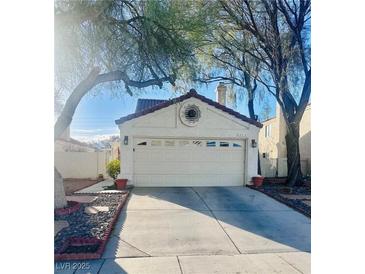 Charming home featuring a spacious two-car garage and an ample concrete driveway at 3916 Rhine Way, Las Vegas, NV 89108