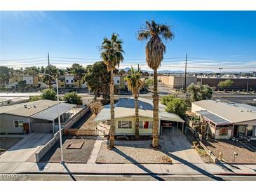 Charming single-story home featuring three palm trees, a covered carport, and well-maintained landscaping at 5217 Sir James Way, Las Vegas, NV 89110