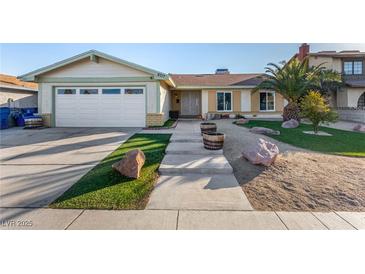 Charming single-story home featuring a well-manicured yard and a two-car garage at 6717 Atwood Ave, Las Vegas, NV 89108