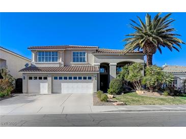 Charming two-story home with a three-car garage and a well-manicured front yard at 153 Ultra Dr, Henderson, NV 89074