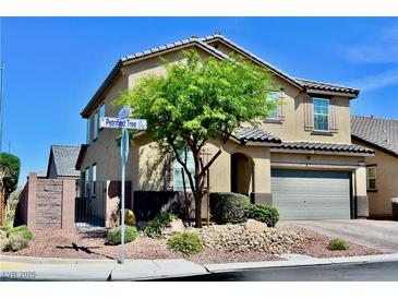 Beautiful two story home with a well manicured front yard and mature landscaping at 5705 Petrified Tree Ln, North Las Vegas, NV 89081