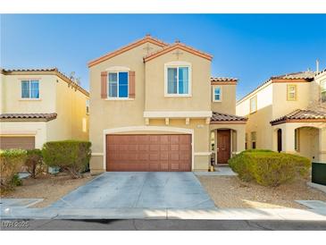 Charming two-story home featuring a well-kept lawn and a classic two-car garage at 7681 Black River St, Las Vegas, NV 89139