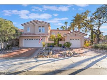 Charming two-story home featuring a well-maintained yard, a tile roof, and a two-car garage at 8225 Taos Paseo Ave, Las Vegas, NV 89128
