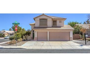 Charming two-story home featuring a two-car garage and well-maintained front yard at 2180 Maple Shade St, Henderson, NV 89002