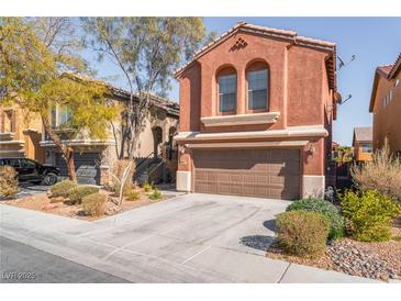 Charming two-story home featuring a two-car garage and desert landscaping at 4740 Killington St, Las Vegas, NV 89129