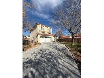 Charming two-story home with attached garage and long private driveway at 5214 Monterey Park Cir, Las Vegas, NV 89146