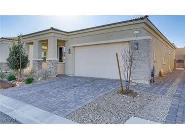 Charming single-story home featuring a stylish paver driveway and a two-car garage at 8729 Marcana St, Las Vegas, NV 89166