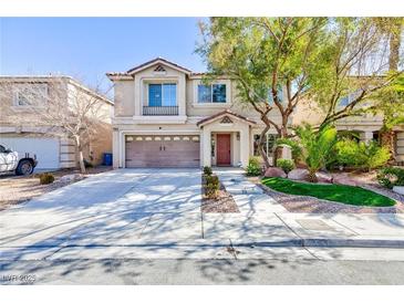 Charming two-story home boasts a well-manicured lawn and inviting front entrance at 10608 Medicine Bow St, Las Vegas, NV 89183