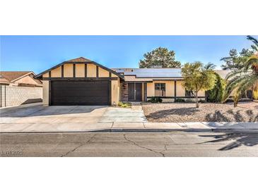 Charming one-story home featuring a two-car garage, solar panels, and low maintenance landscaping at 3337 Irv Marcus Dr, Las Vegas, NV 89108