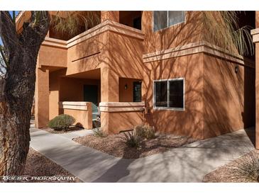 Beautiful multi-story building with a light brown exterior and well maintained landscaping at 378 Colleen Ct # G, Mesquite, NV 89027