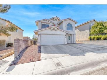 Charming two-story home featuring a well-maintained front yard and attached two-car garage at 5301 Padua Way, Las Vegas, NV 89107