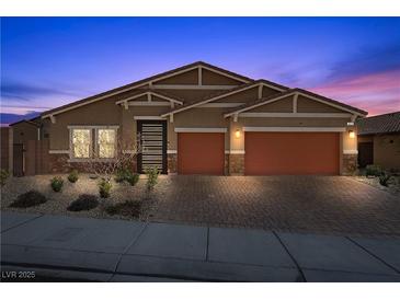 Charming single-story home with a two-car garage and desert landscaping at 8976 S Park St, Las Vegas, NV 89178