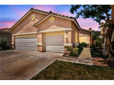 Charming home with a three-car garage and well-maintained landscaping at 1562 Pimlico Hills St, Henderson, NV 89014