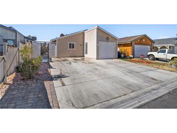 A charming single-story home with a two-car garage and spacious concrete driveway at 4136 Broadriver Dr, Las Vegas, NV 89108