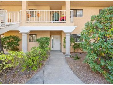 Inviting entryway with a well-manicured walkway leading to the front door of this charming condo at 2851 S Valley View Blvd # 1150, Las Vegas, NV 89102
