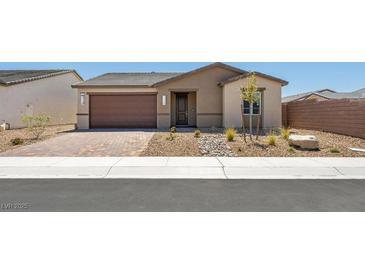 Charming single-story home with a two-car garage and desert landscaping at 4485 E Brusca Way, Pahrump, NV 89061