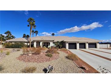 Beautiful single-story home with manicured desert landscaping and a three-car garage at 8290 Gagnier Blvd, Las Vegas, NV 89113