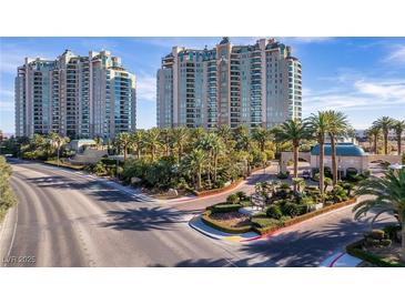Stunning high-rise condos feature lush landscaping, palm trees, and gated entry at 9103 Alta Dr # 102, Las Vegas, NV 89145
