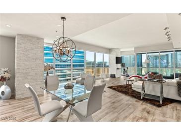 Bright and airy living room features floor to ceiling windows and an open floor plan at 4525 Dean Martin Dr # 2800, Las Vegas, NV 89103