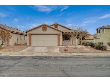 Charming single story home featuring a two-car garage and covered porch at 612 Bullwhip Ct, Henderson, NV 89011