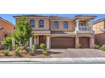 Attractive two-story home featuring a well-manicured front yard and attached two-car garage at 6461 Mount Eden Ave, Las Vegas, NV 89139
