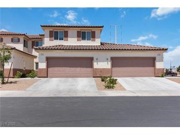 Charming two-story home with attached two-car garage and well-manicured landscaping at 1410 Pink Dawn Dr, Henderson, NV 89014