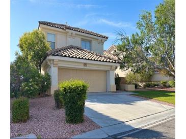 Inviting two-story home with a well-maintained front yard and attached two-car garage at 1960 Verbania Dr, Las Vegas, NV 89134