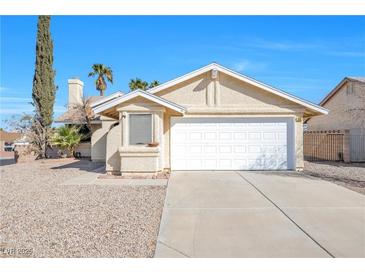 Charming single-story home with low-maintenance landscaping and a two-car garage, perfect for first-time buyers at 325 Wintercress Dr, Henderson, NV 89002