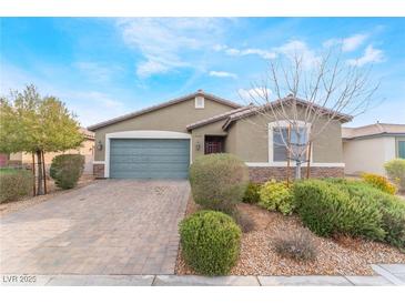 Charming single-story home with a paved driveway and desert landscaping at 5648 Alitak Bay St, North Las Vegas, NV 89081