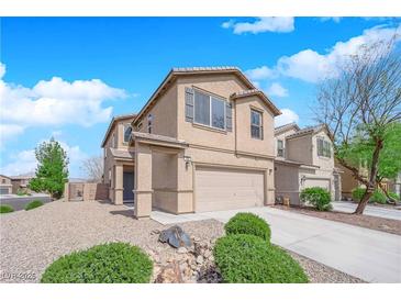 Inviting two-story home featuring a two-car garage and a well-maintained, xeriscaped front yard at 108 Fiery Hill Ave, Henderson, NV 89011