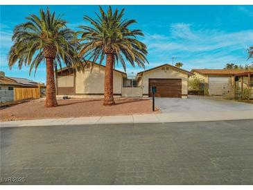 Charming single-story home featuring desert landscaping, a two-car garage, and gated courtyard at 6870 Laronda Ln, Las Vegas, NV 89156
