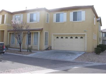 Two story home with a front yard, two car garage and neutral paint at 8003 Retriever Ave, Las Vegas, NV 89147