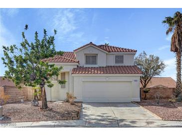 Charming two-story home with stucco siding, a red tile roof, and a two-car garage at 2573 Rafferty Creek Ln, Las Vegas, NV 89156