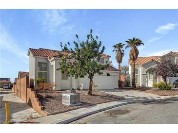 Charming two-story home features a well-maintained yard and desert landscaping at 2573 Rafferty Creek Ln, Las Vegas, NV 89156