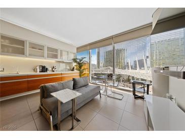 Modern living space with sleek cabinetry, city views, and comfortable seating at 3726 Las Vegas Blvd # 303, Las Vegas, NV 89158
