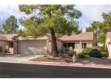 Charming single-story home with a well-maintained front yard and two-car garage at 425 Golden State St, Henderson, NV 89012