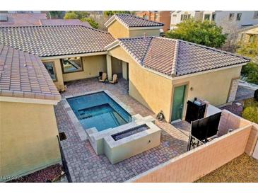 A beautiful backyard pool and patio area offer a private space for relaxation and outdoor enjoyment at 7331 Abundant Harvest Ave, Las Vegas, NV 89131