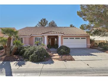 Charming single-story home featuring a well-manicured yard and a two-car garage at 7501 Bush Garden Ave, Las Vegas, NV 89129